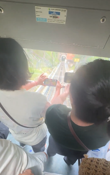 有片｜中國女馬來西亞纜車爭頭位打卡爆「京滬大戰」！網友批行為丟架：丟人丟到國外 