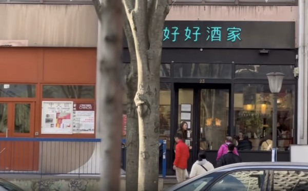 街道上出現「新樂園大酒家」、「好好酒家」等中文招牌的店舖，整體氛圍充滿港式情懷。圖片來源：Threads