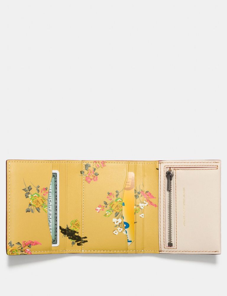 Small Trifold Wallet With Floral Print Interior US$112.50
