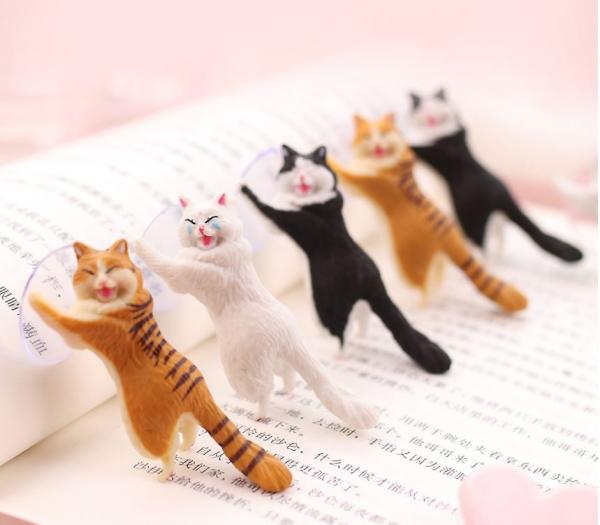 韓國設計可憐樣貓咪手機托架！慘貓喊住幫手托電話
