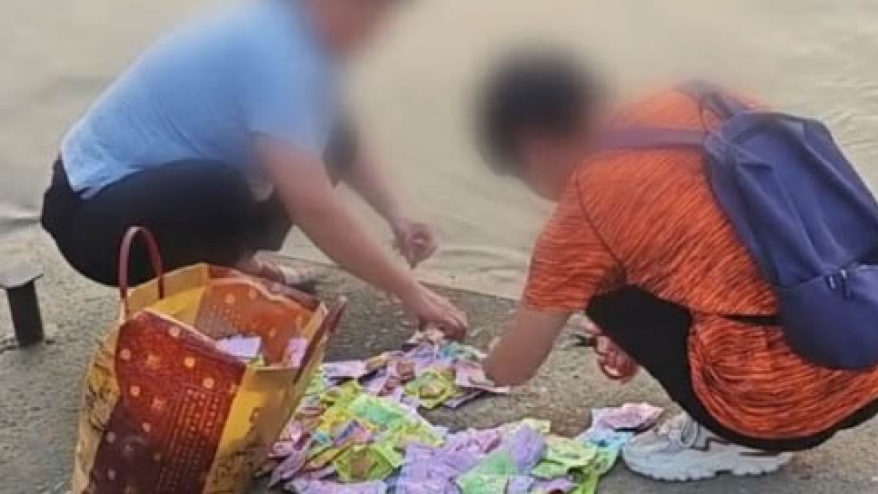 東莞兩女子江邊「放生」魚豆腐　 網民：放生人民幣請通知我