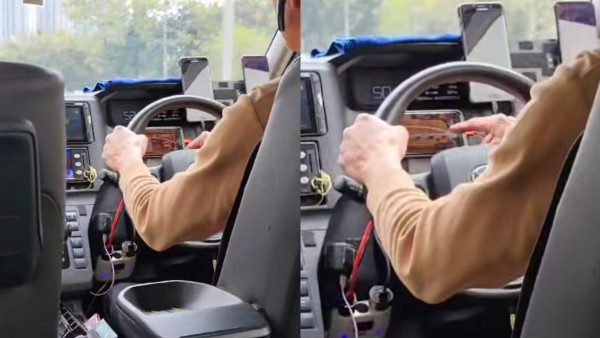 的士司機行車期間玩手機打牌？電話擺軚盤內！網民鬧爆：極度危害道路使用者
